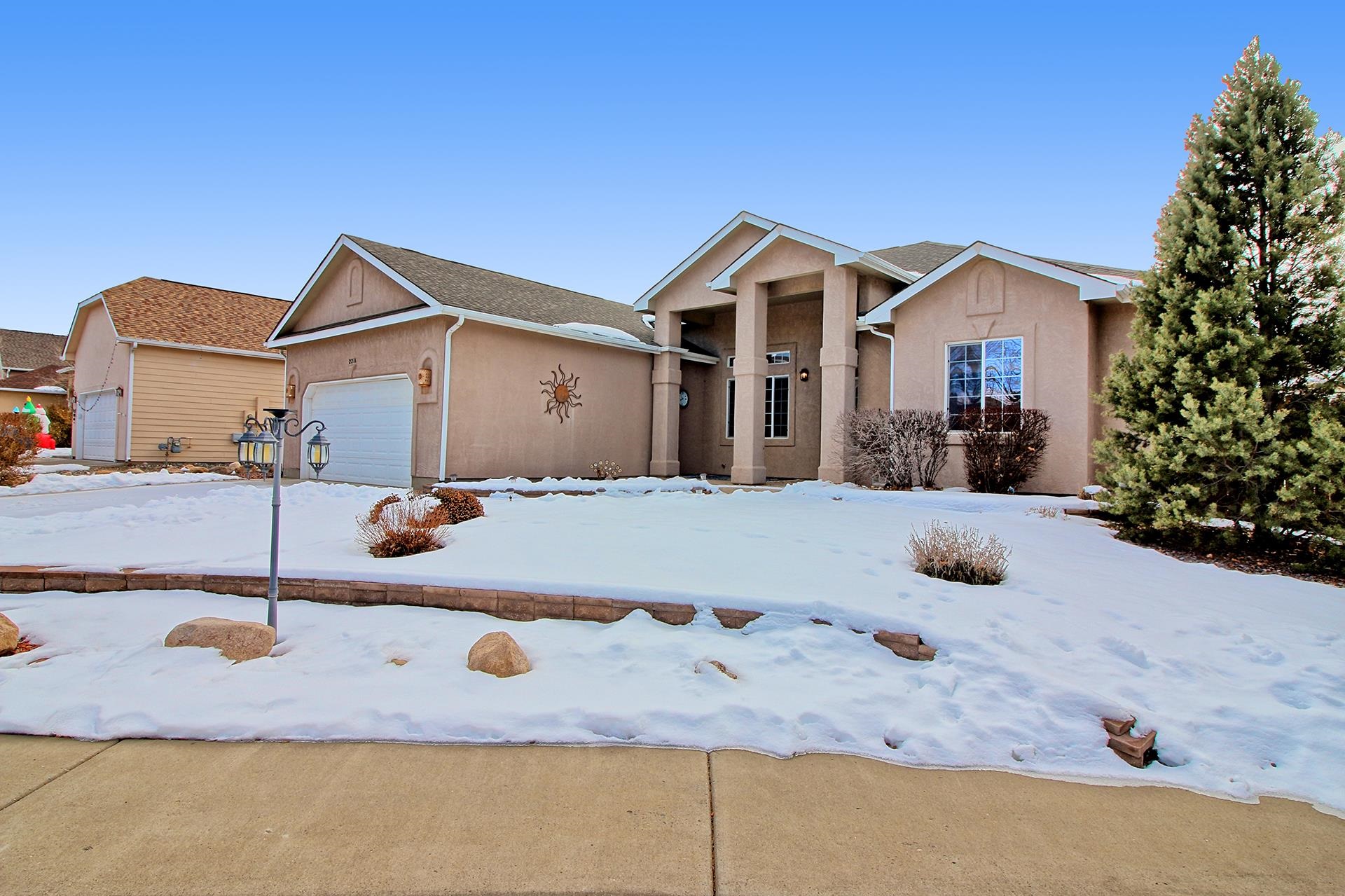 2211 Victorian Court Grand Junction, CO 81507 - Photo 15 of 42 a front view of a house with yard