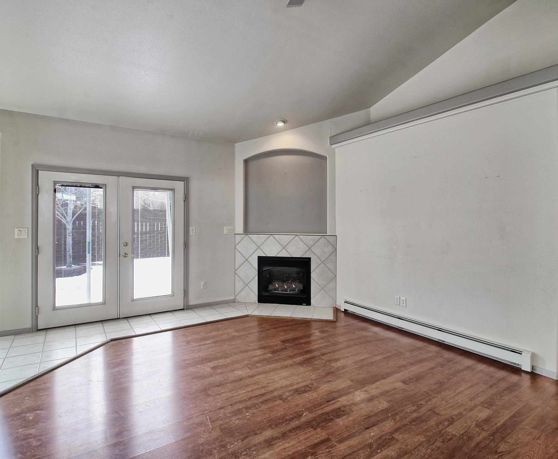2211 Victorian Court Grand Junction, CO 81507 - Photo 22 of 42 wooden floor fireplace and natural light in room