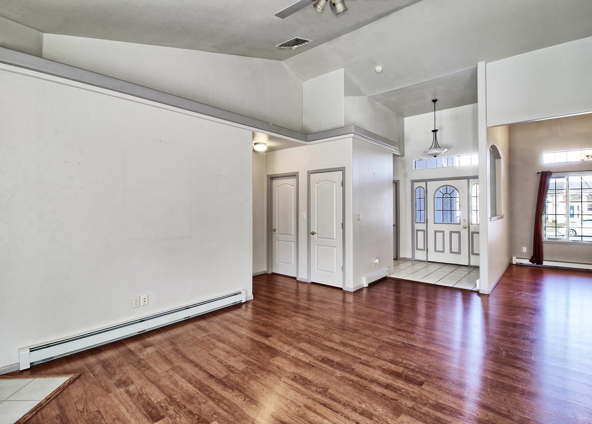 2211 Victorian Court Grand Junction, CO 81507 - Photo 23 of 42 a view of an empty room with wooden floor and a window