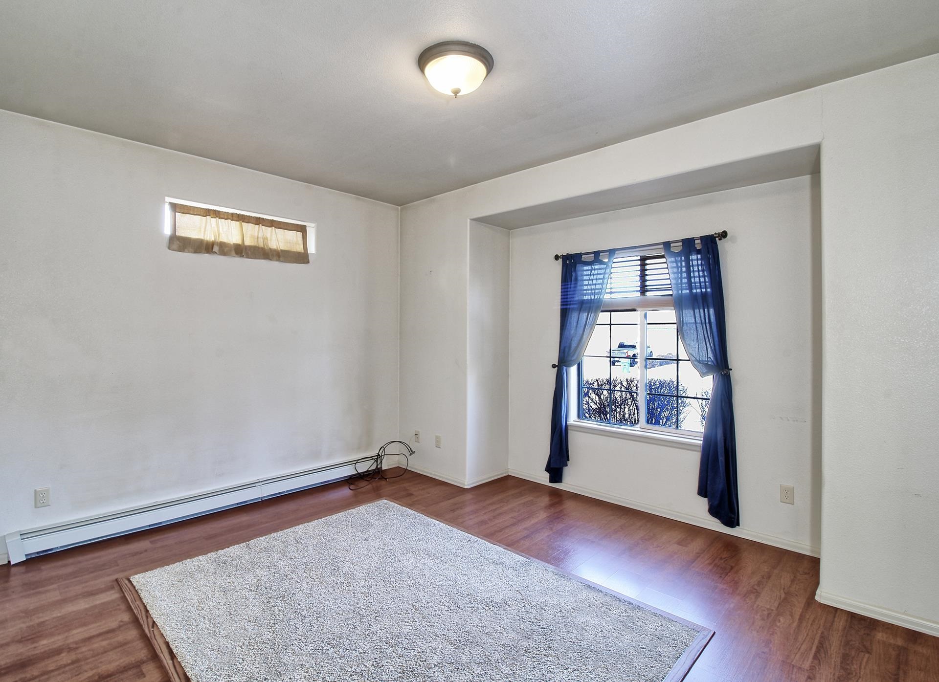 2211 Victorian Court Grand Junction, CO 81507 - Photo 25 of 42 wooden floor in an empty room with a window