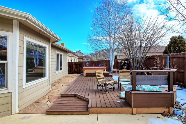 a view of a backyard with sitting area