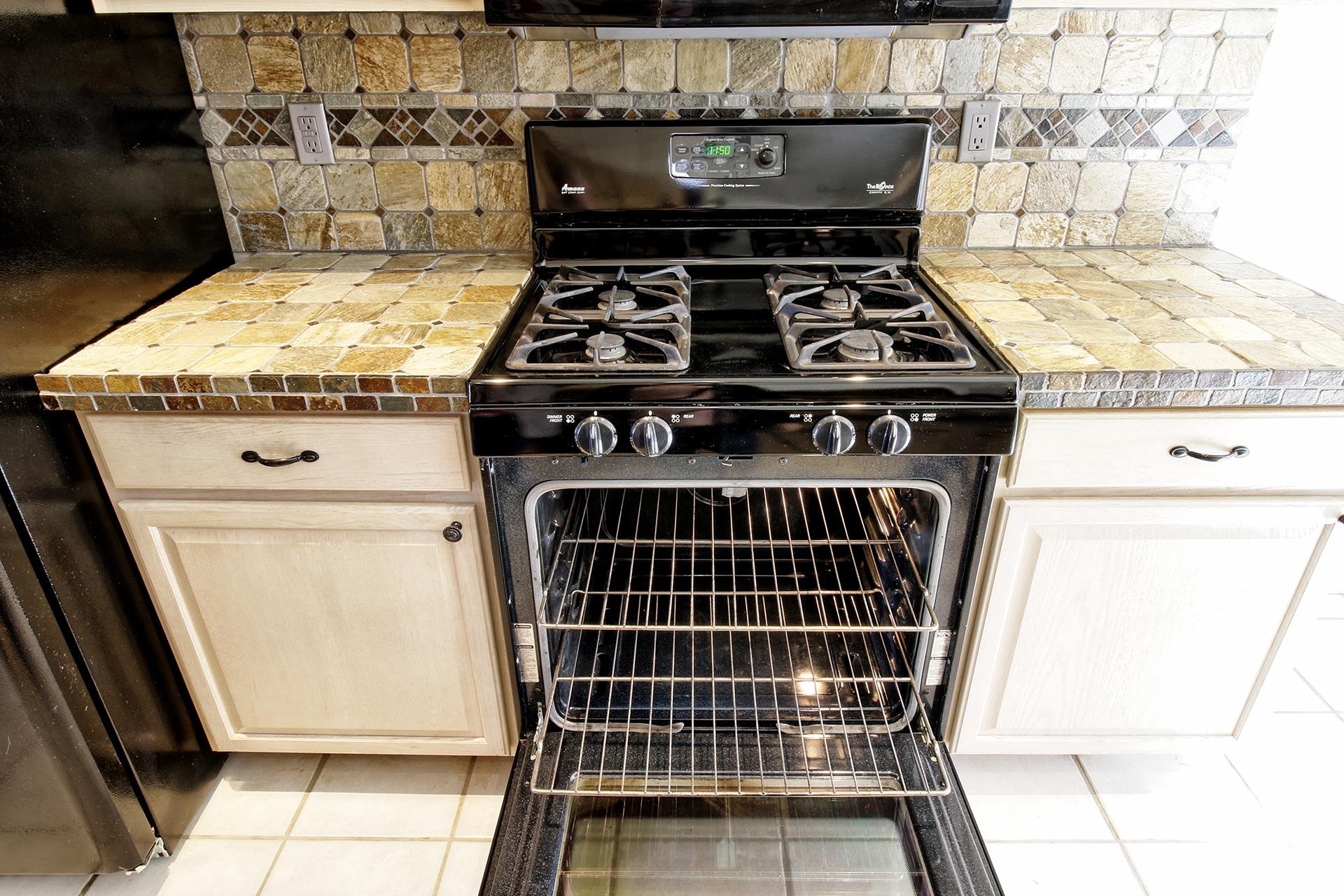 2211 Victorian Court Grand Junction, CO 81507 - Photo 34 of 42 a stove top oven sitting inside of a kitchen