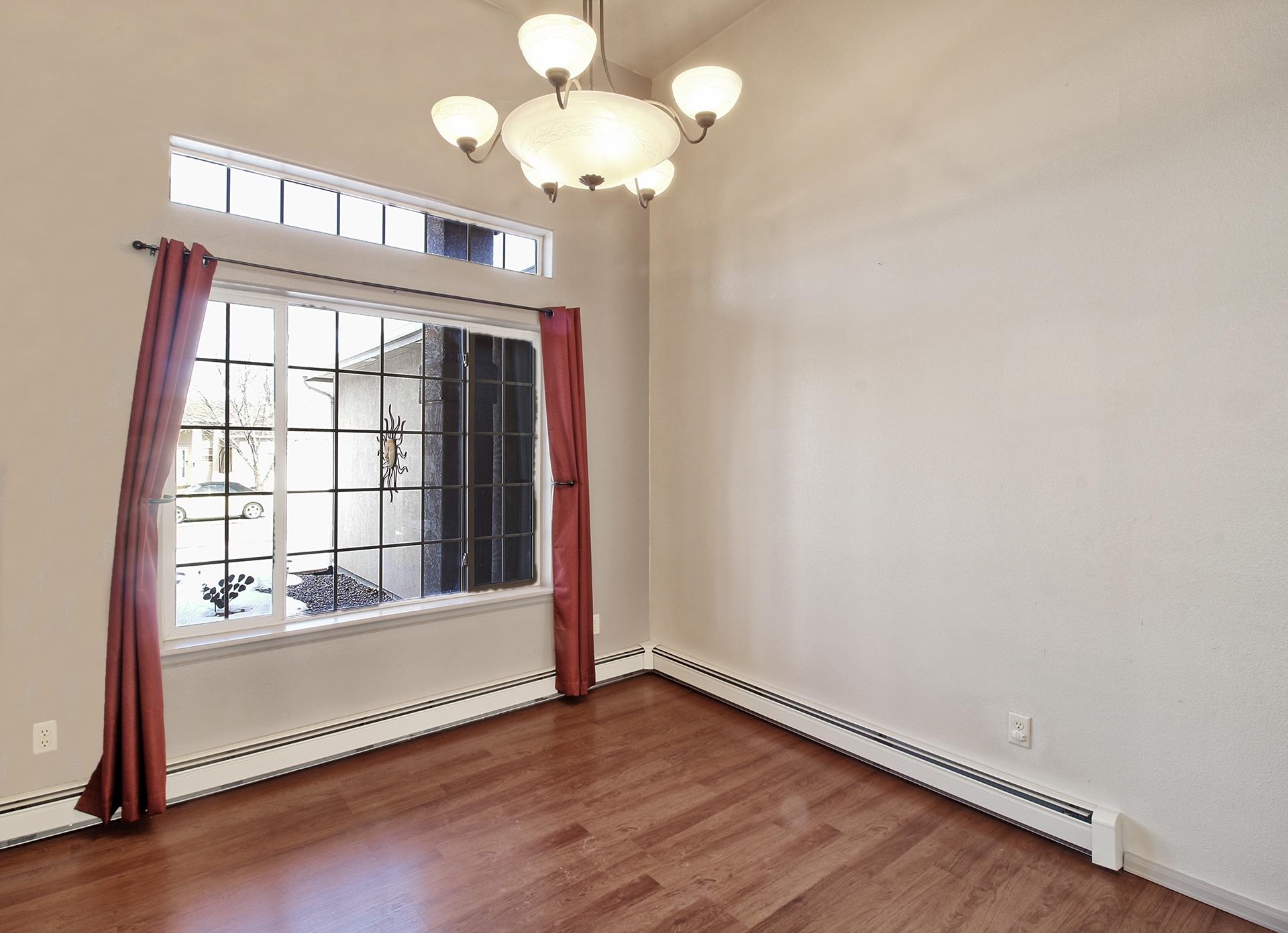 2211 Victorian Court Grand Junction, CO 81507 - Photo 37 of 42 a view of an empty room with wooden floor and a window
