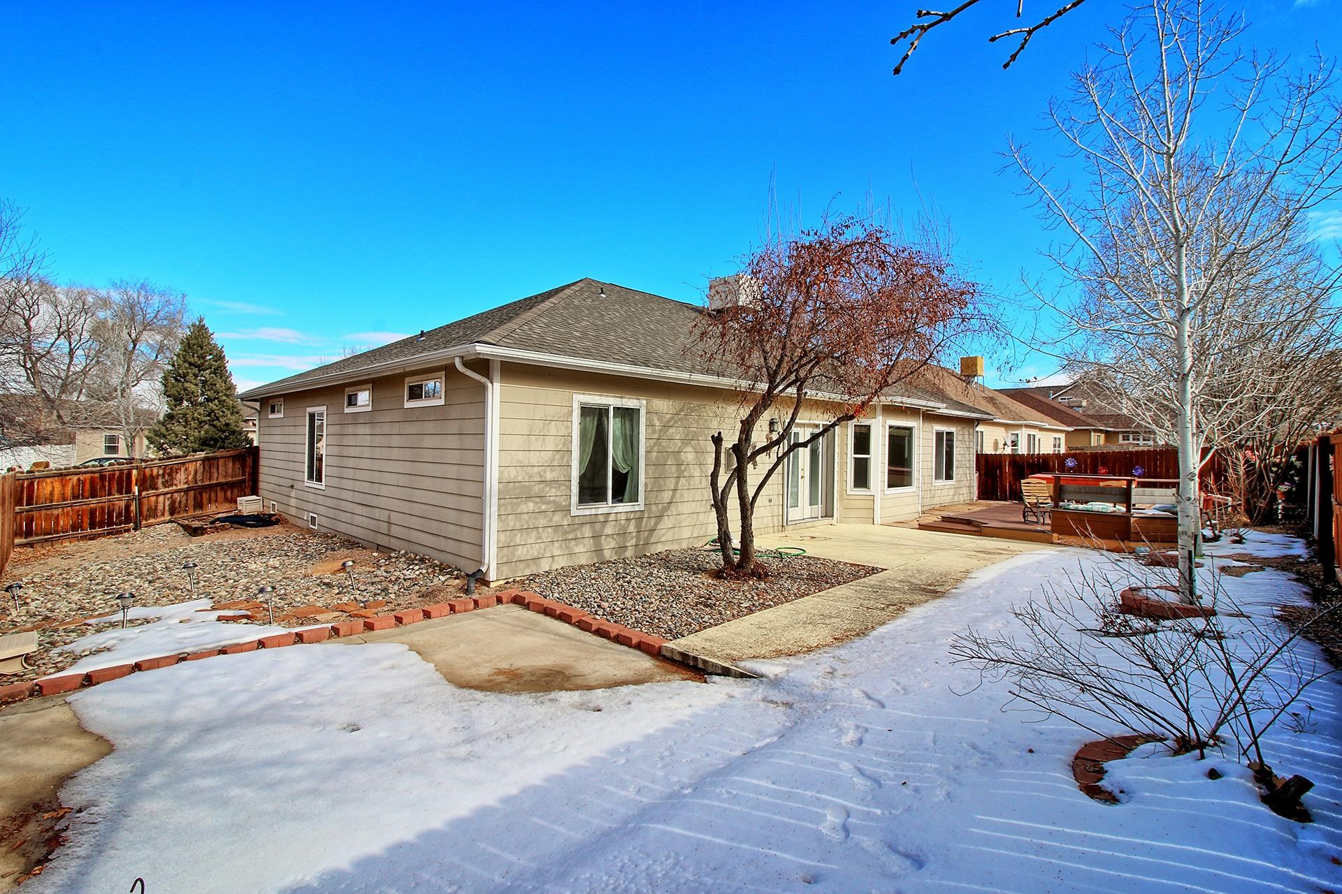 2211 Victorian Court Grand Junction, CO 81507 - Photo 4 of 42 a front view of a house with a yard