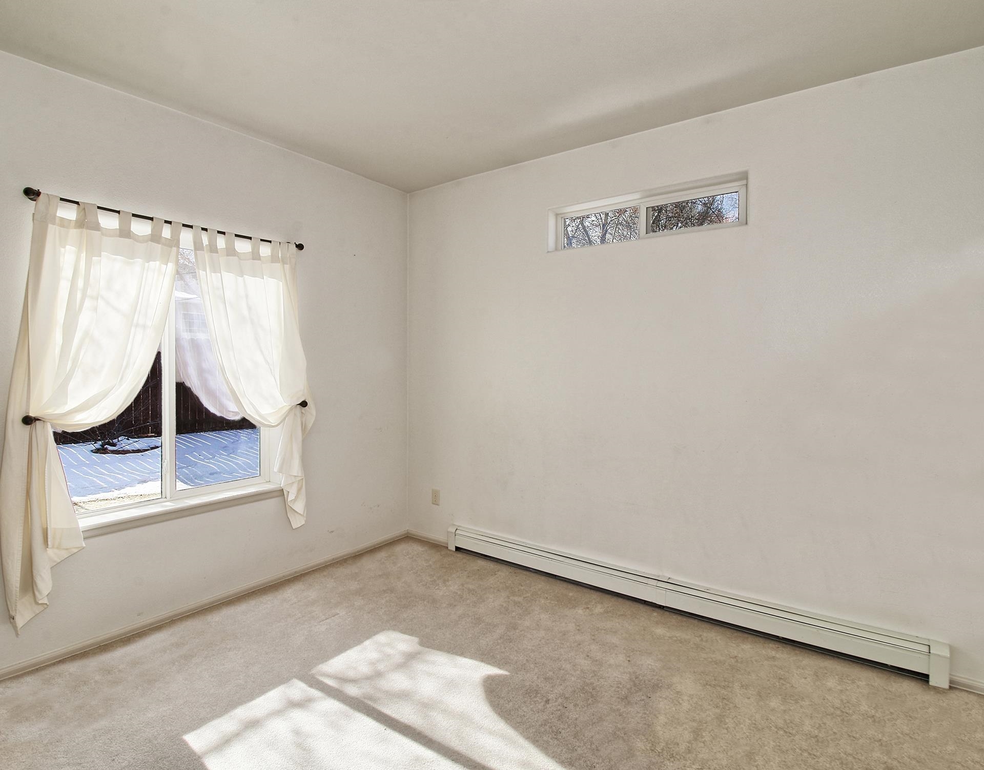 2211 Victorian Court Grand Junction, CO 81507 - Photo 7 of 42 a view of a room with wooden floor and windows