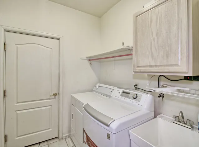 a utility room with dryer and washer