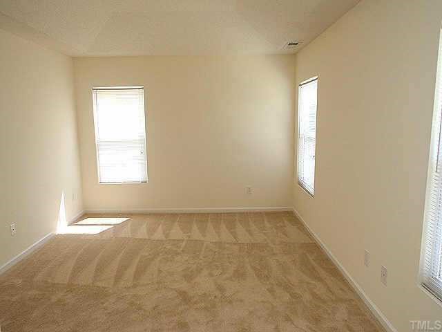 3674 Marshlane Way Raleigh, NC 27610 - Photo 7 of 8 a view of an empty room and window