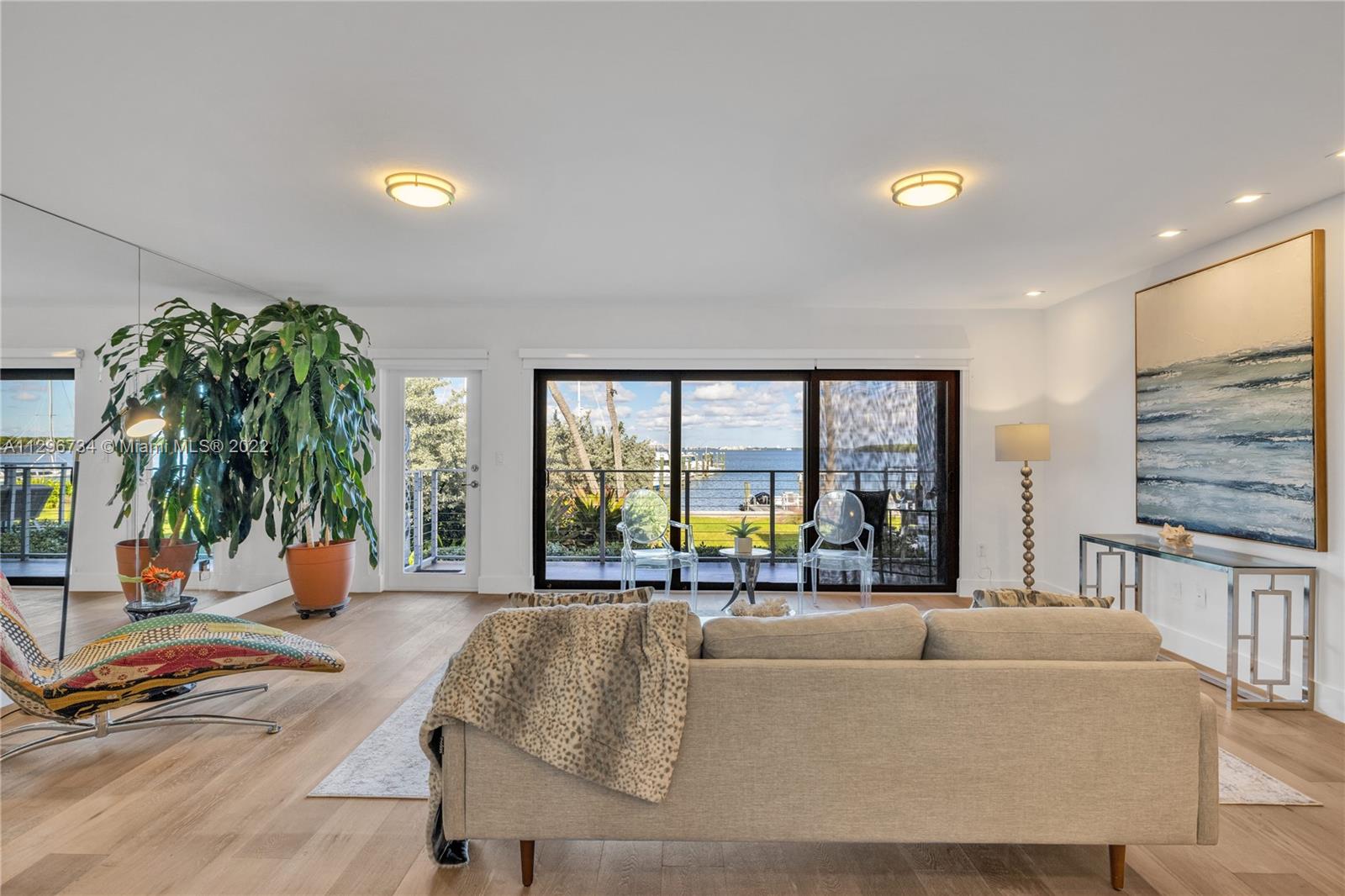 166 Harbor Drive, Unit 1A Key Biscayne, FL 33149 - Photo 12 of 86 a living room with furniture and large windows