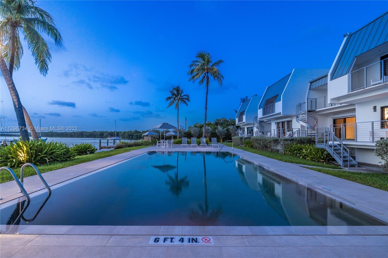 166 Harbor Drive, Unit 1A Key Biscayne, FL 33149 - Photo 24 of 86 a view of a house with a swimming pool