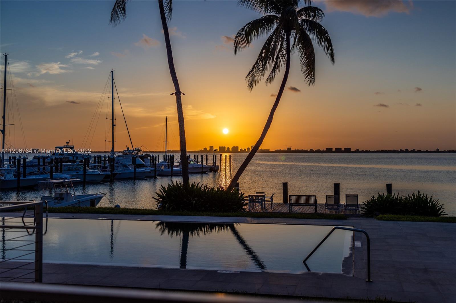 166 Harbor Drive, Unit 1A Key Biscayne, FL 33149 - Photo 33 of 86 a view of a lake with boats and a bridge