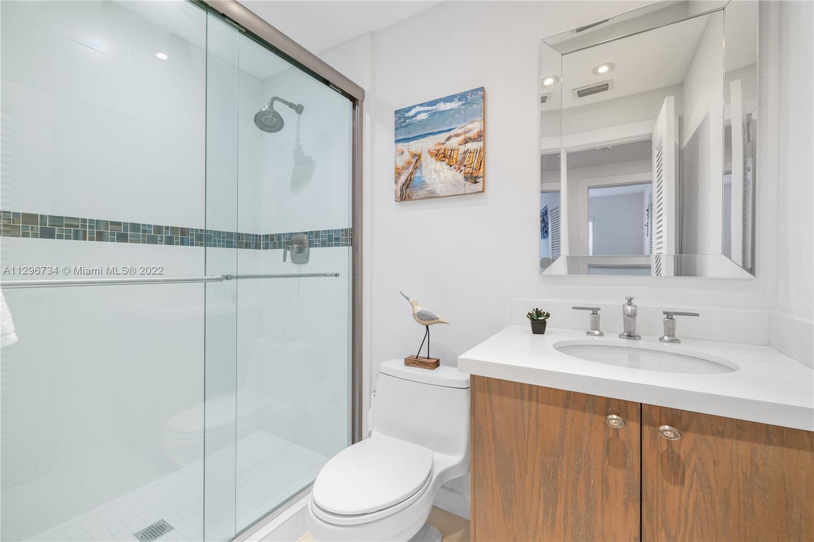166 Harbor Drive, Unit 1A Key Biscayne, FL 33149 - Photo 36 of 86 a bathroom with a sink a toilet and shower