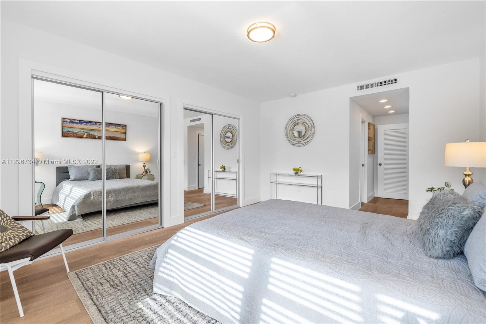 166 Harbor Drive, Unit 1A Key Biscayne, FL 33149 - Photo 38 of 86 a bedroom with a large bed and a view of bedroom