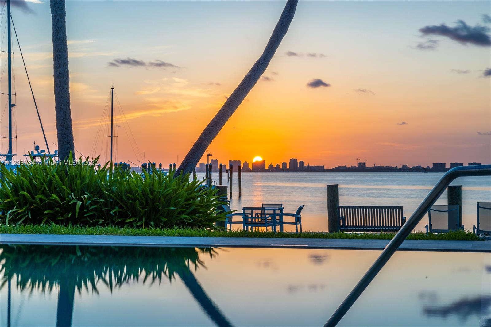 166 Harbor Drive, Unit 1A Key Biscayne, FL 33149 - Photo 40 of 86 a view of a swimming pool with a lake view