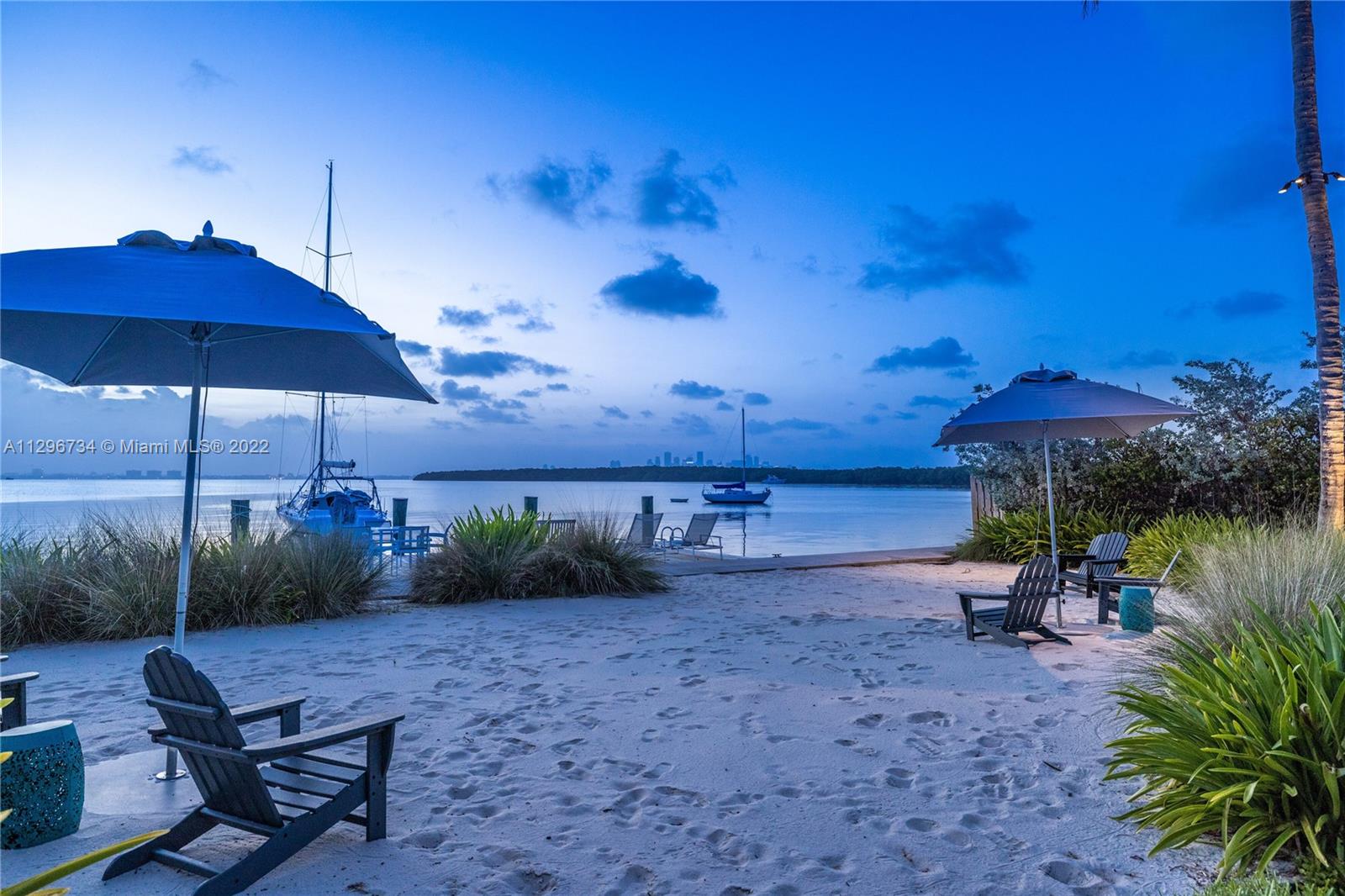 166 Harbor Drive, Unit 1A Key Biscayne, FL 33149 - Photo 4 of 86 a view of a backyard with plants and outdoor seating
