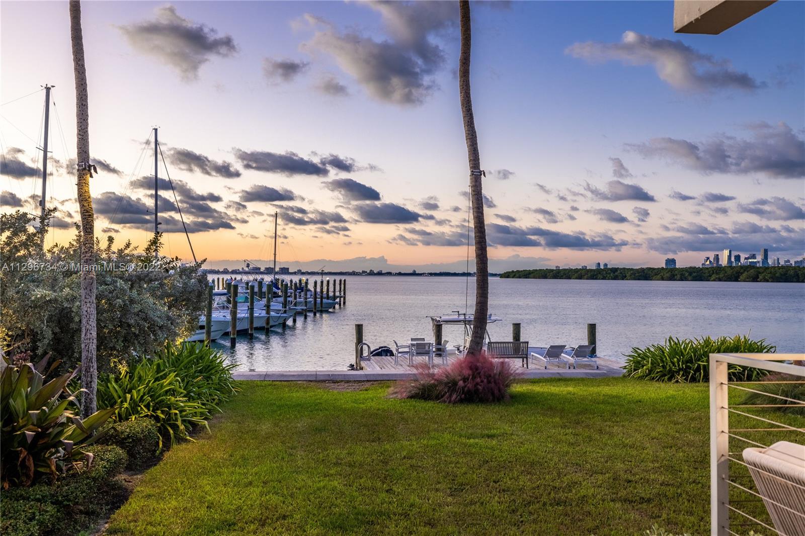 166 Harbor Drive, Unit 1A Key Biscayne, FL 33149 - Photo 43 of 86 a view of a swimming pool with a yard