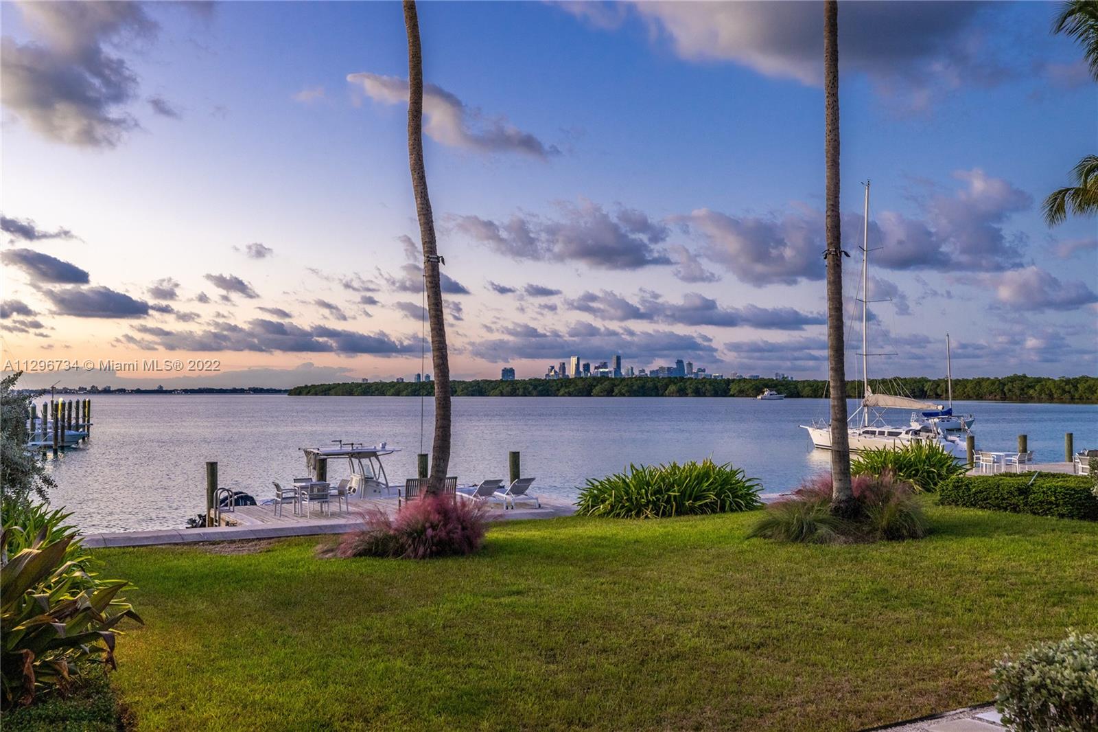 166 Harbor Drive, Unit 1A Key Biscayne, FL 33149 - Photo 49 of 86 a view of a lake with a big yard
