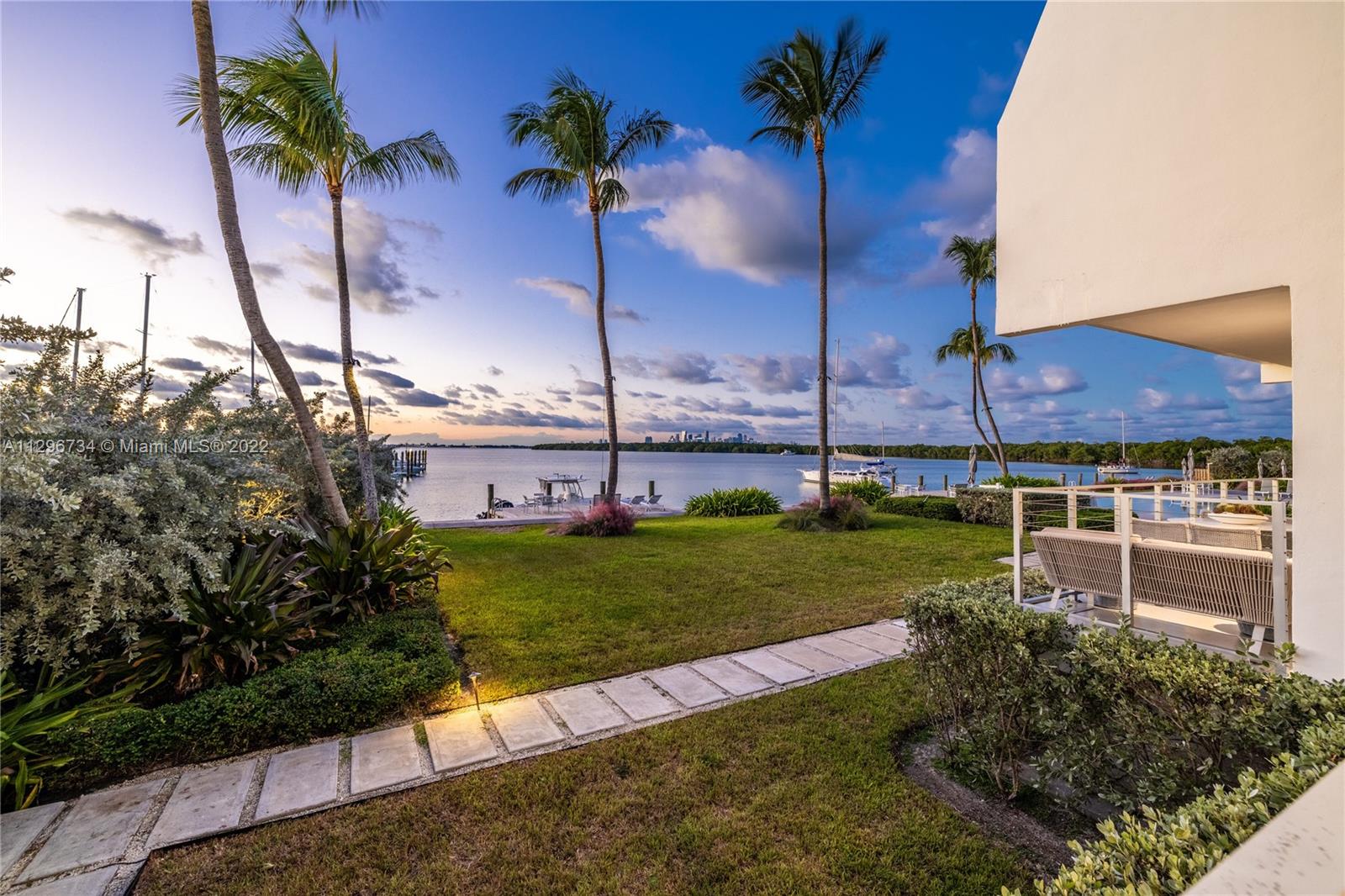 166 Harbor Drive, Unit 1A Key Biscayne, FL 33149 - Photo 50 of 86 a view of a garden with a house