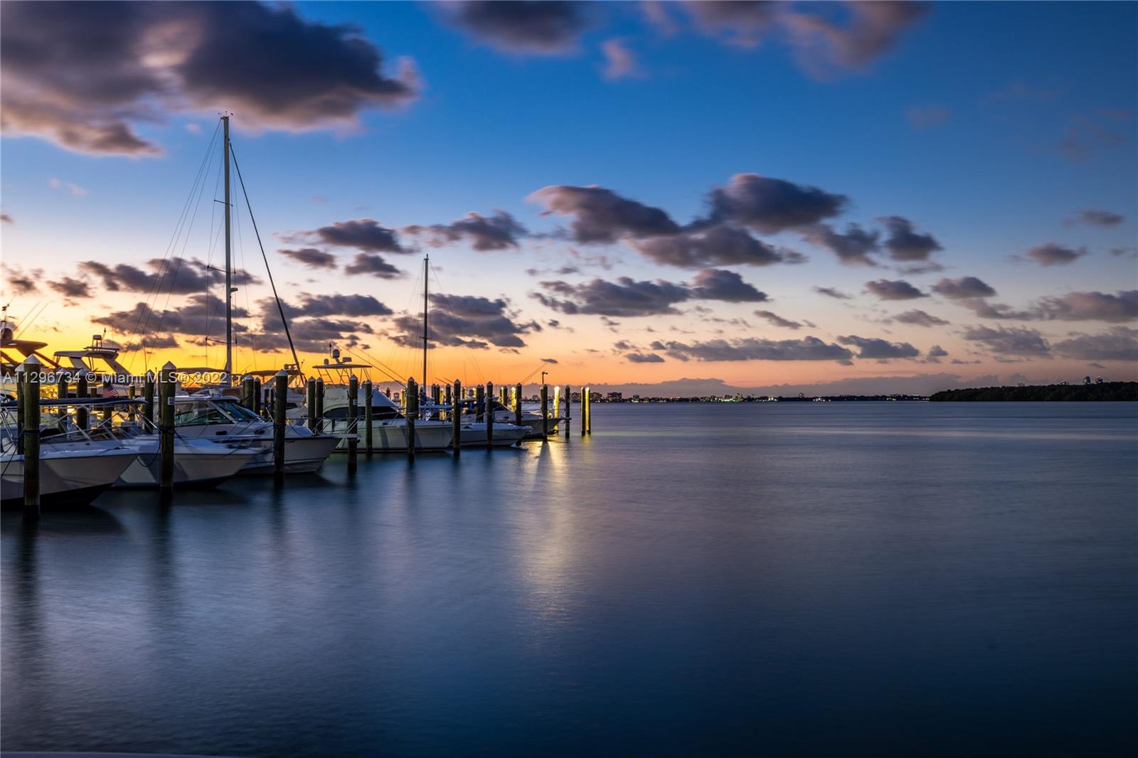166 Harbor Drive, Unit 1A Key Biscayne, FL 33149 - Photo 55 of 86 a view of swimming pool with lounge chair