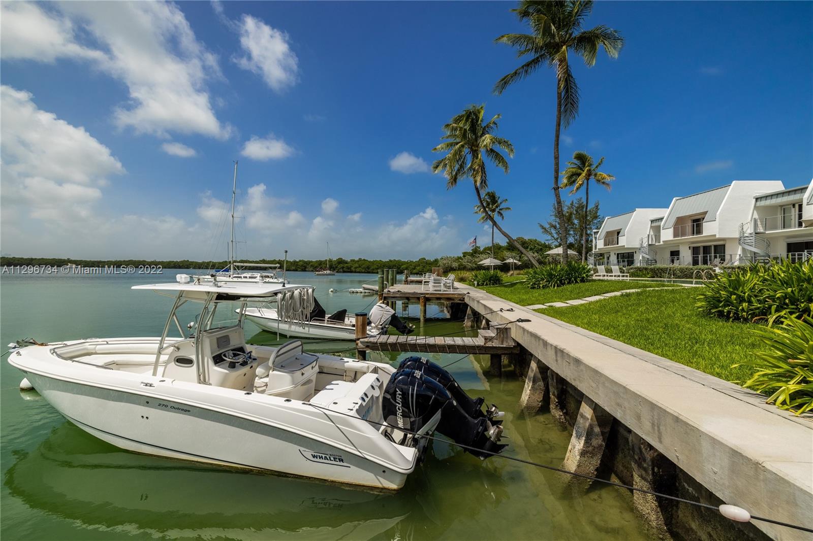 166 Harbor Drive, Unit 1A Key Biscayne, FL 33149 - Photo 67 of 86 a view of swimming pool with outdoor seating and plants