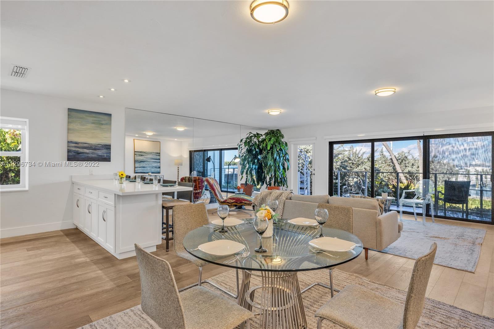 166 Harbor Drive, Unit 1A Key Biscayne, FL 33149 - Photo 7 of 86 a view of a dining room with furniture large windows and wooden floor
