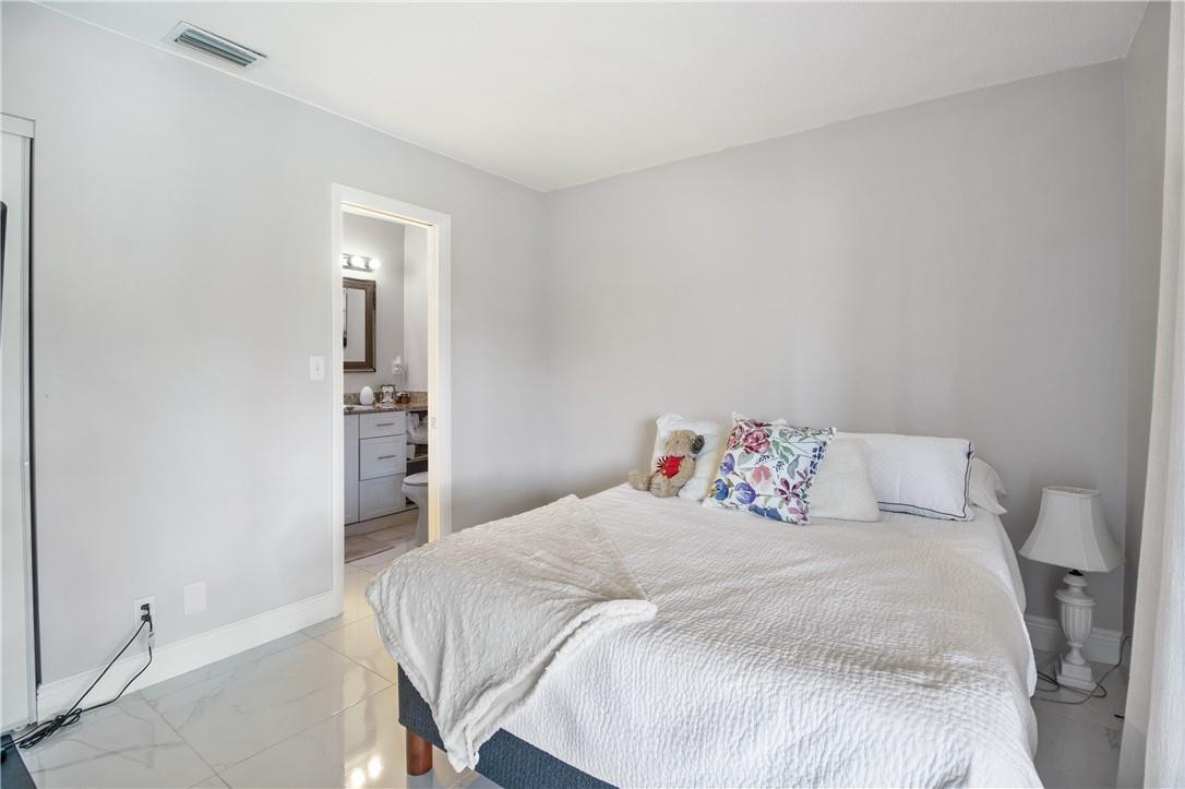 727 Banks Road, Unit 98 Margate, FL 33063 - Photo 18 of 22 a bedroom with a bed and closet