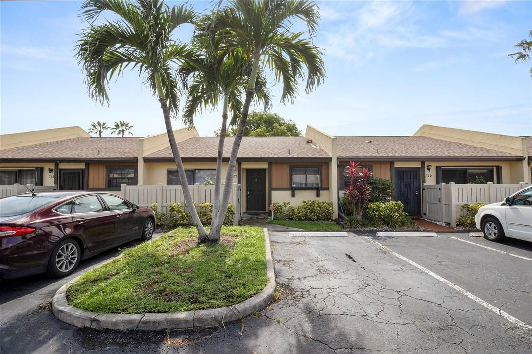727 Banks Road, Unit 98 Margate, FL 33063 - Photo 2 of 22 a front view of a house with garden