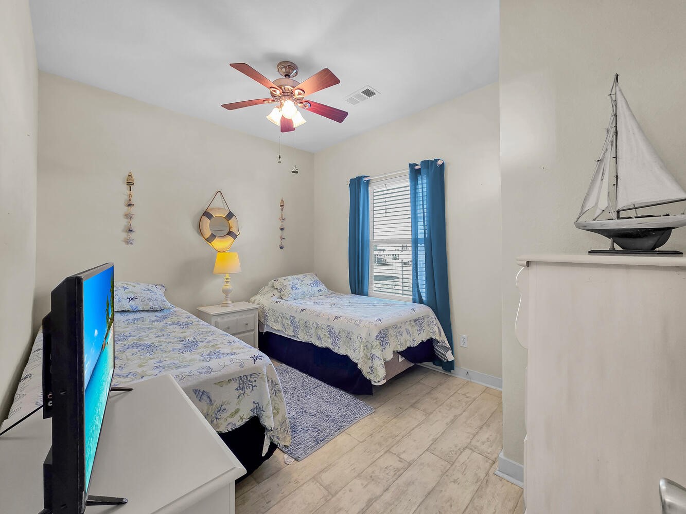 2577 Holiday Crystal Beach, TX 77650 - Photo 19 of 36 a bedroom with a bed and a chandelier