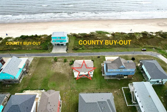 a view of a city with mountains in the background