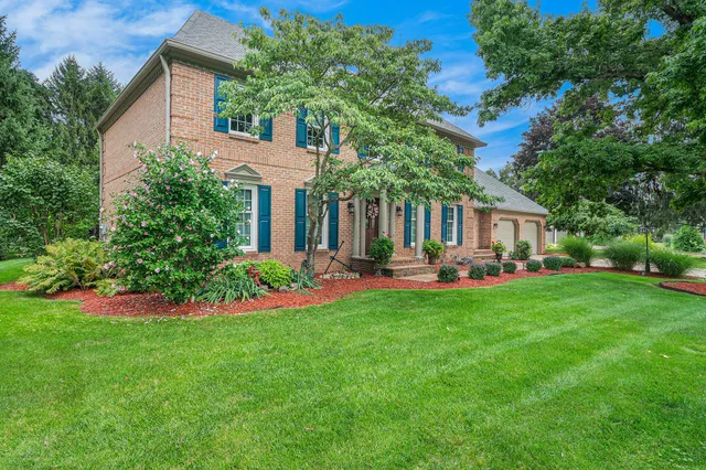 a front view of house with yard and outdoor seating