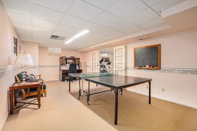 a front view of house with a garden and patio