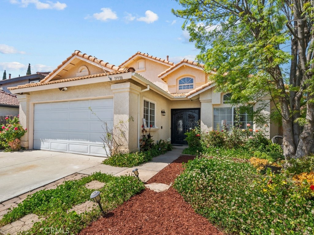 19988 Promenade Circle Riverside, CA 92508 - Photo 1 of 1 a front view of a house with garden