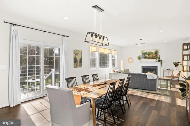 a bathroom with double vanity sink a toilet and a mirror