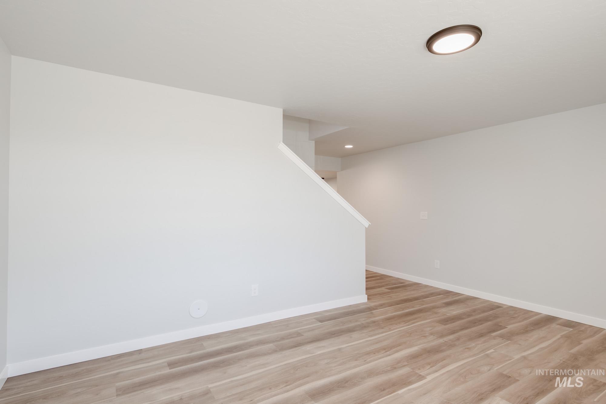 13699 Judson Street Caldwell, ID 83607 - Photo 13 of 26 Unfurnished room with light wood-type flooring and recessed lighting