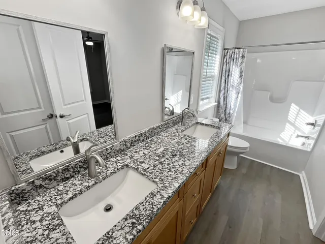 a view of a balcony with wooden floor