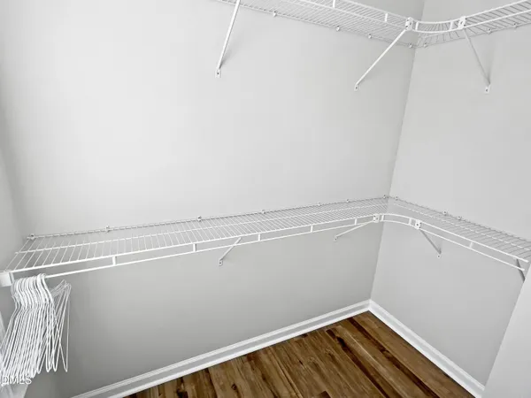 a bathroom with a granite countertop sink toilet a mirror and shower