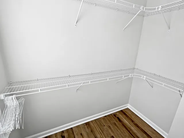 a bathroom with a granite countertop sink toilet a mirror and shower