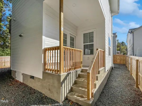 a view of a balcony with wooden floor