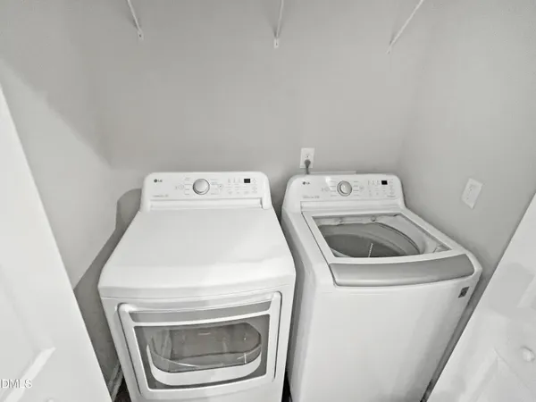 a view of staircase with white walls