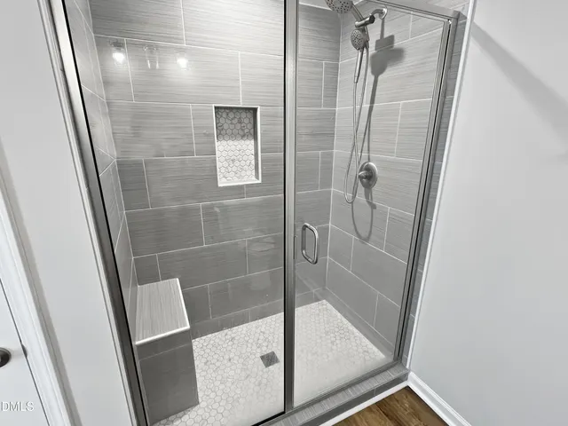 a large kitchen with stainless steel appliances granite countertop a stove a sink and a microwave