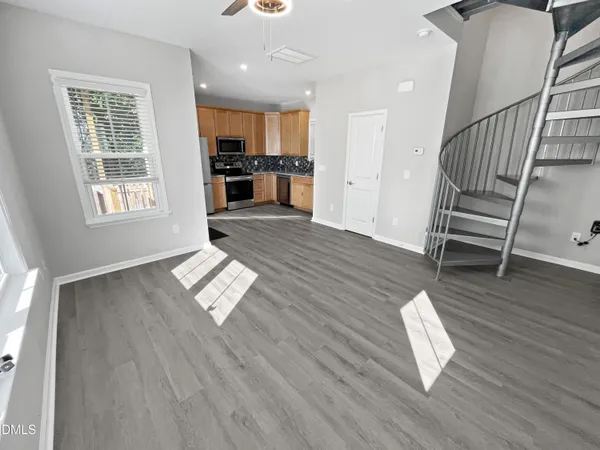 a view of kitchen with furniture and wooden floor