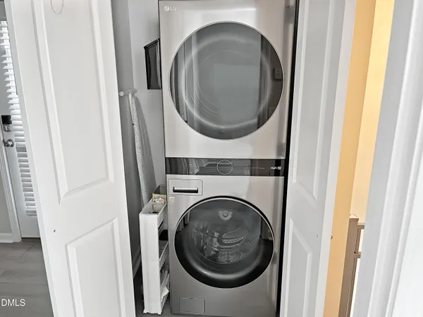 a kitchen with granite countertop a refrigerator a sink a stove a microwave and island