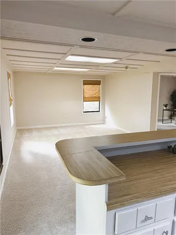 a kitchen with a sink and a window