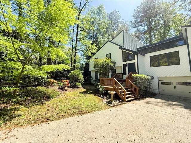 a view of a backyard with a sitting area