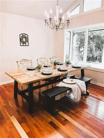a bedroom with furniture and a chandelier