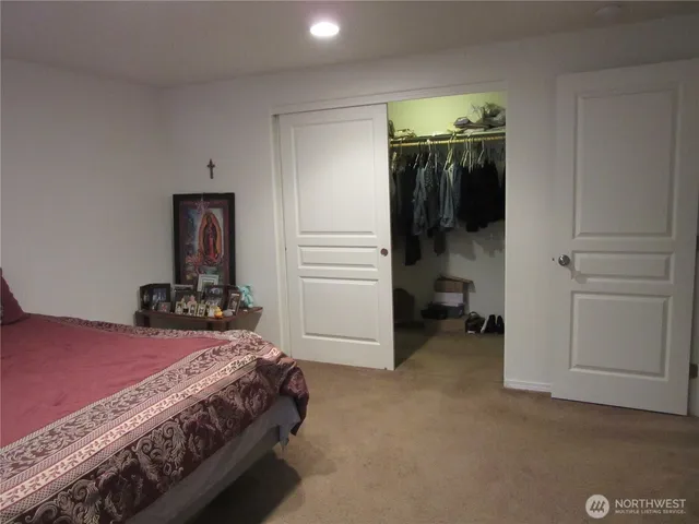 a bedroom with a bed and a cabinets