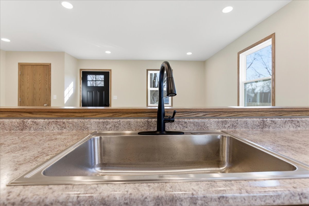 313 East Martin Street Forrest, IL 61741 - Photo 11 of 50 a kitchen with a sink and a mirror