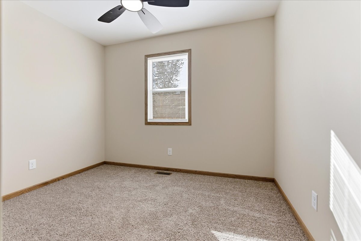 313 East Martin Street Forrest, IL 61741 - Photo 17 of 50 an empty room with a window