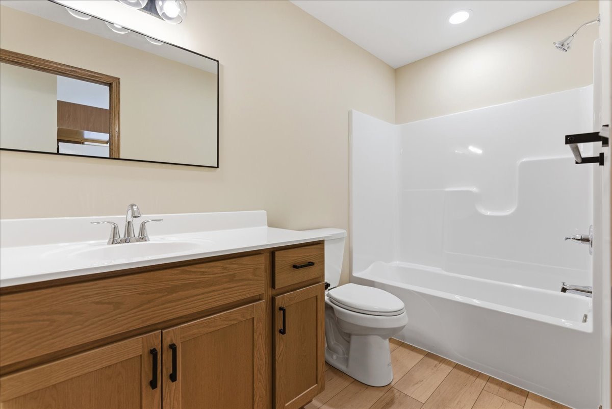 313 East Martin Street Forrest, IL 61741 - Photo 19 of 50 a bathroom with a sink a toilet and shower