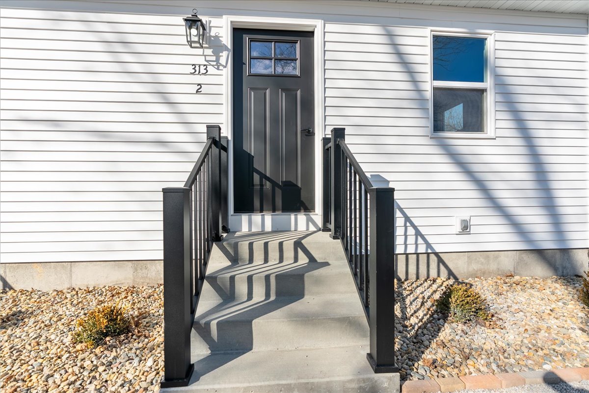 313 East Martin Street Forrest, IL 61741 - Photo 25 of 50 a view of stairs with wooden floor and fence