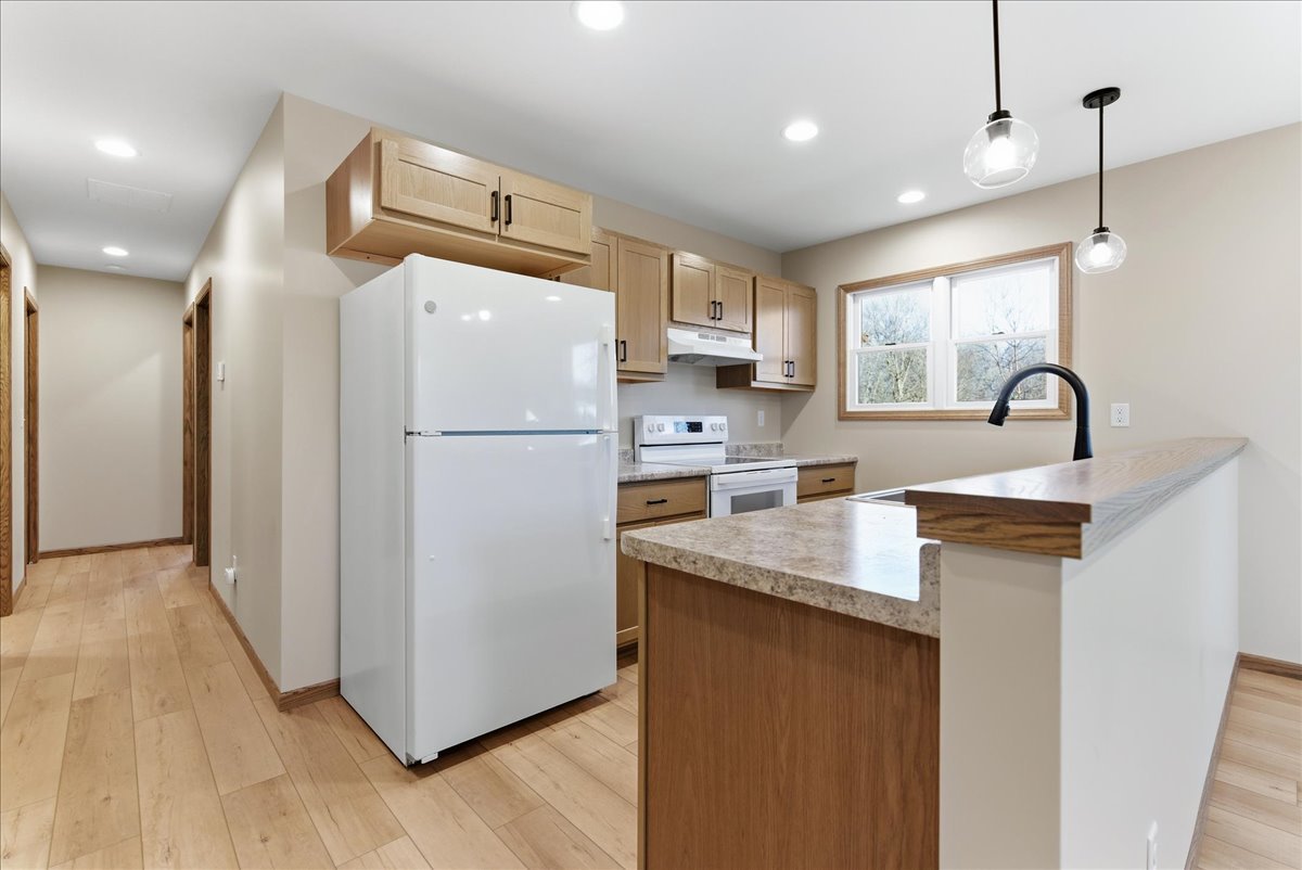 313 East Martin Street Forrest, IL 61741 - Photo 32 of 50 a kitchen with refrigerator cabinets and a sink